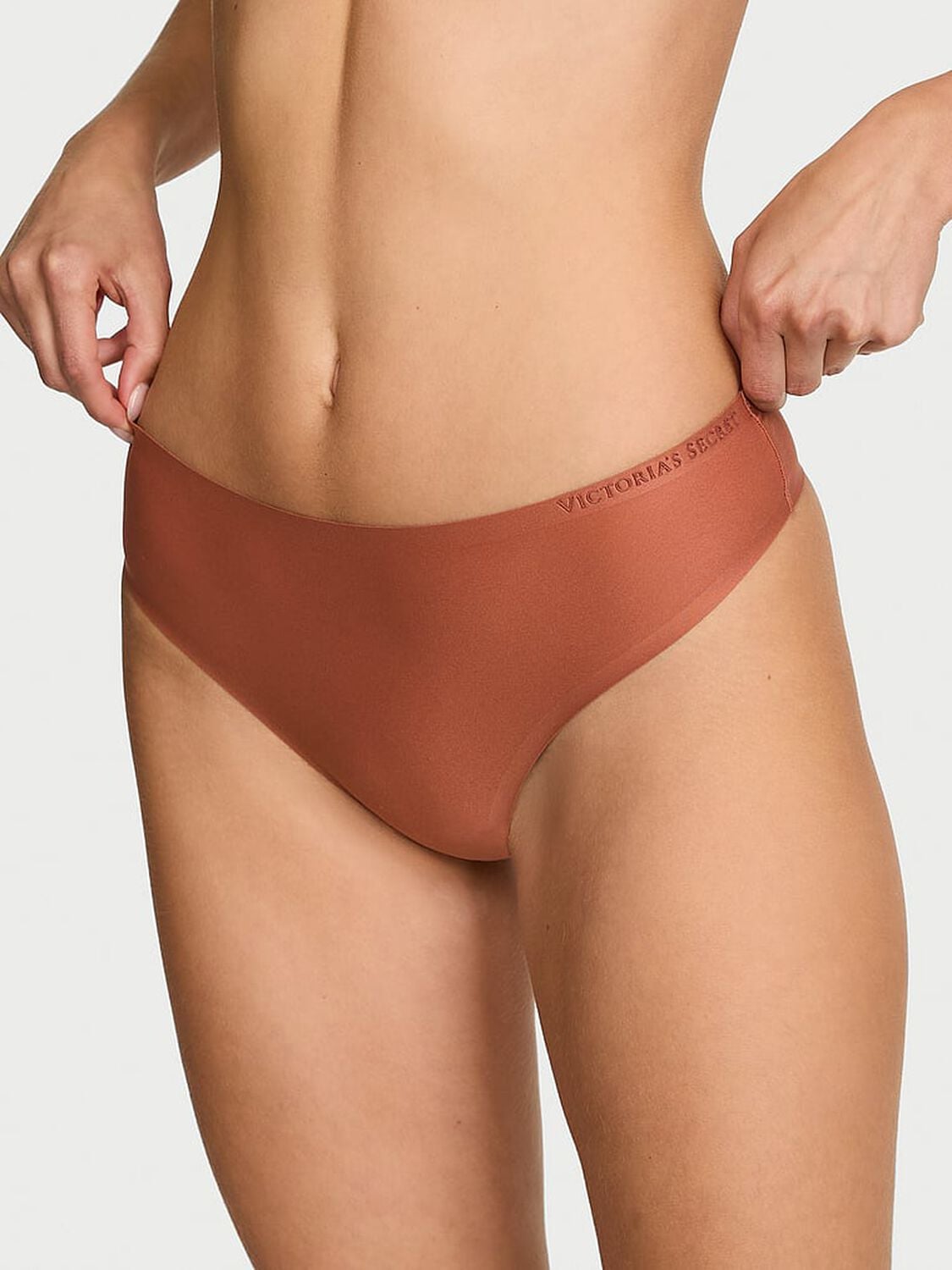 vs Body By Victoria Body by Victoria Flex Mid-Rise Thong Panty Copper Brown 1 of 3 
