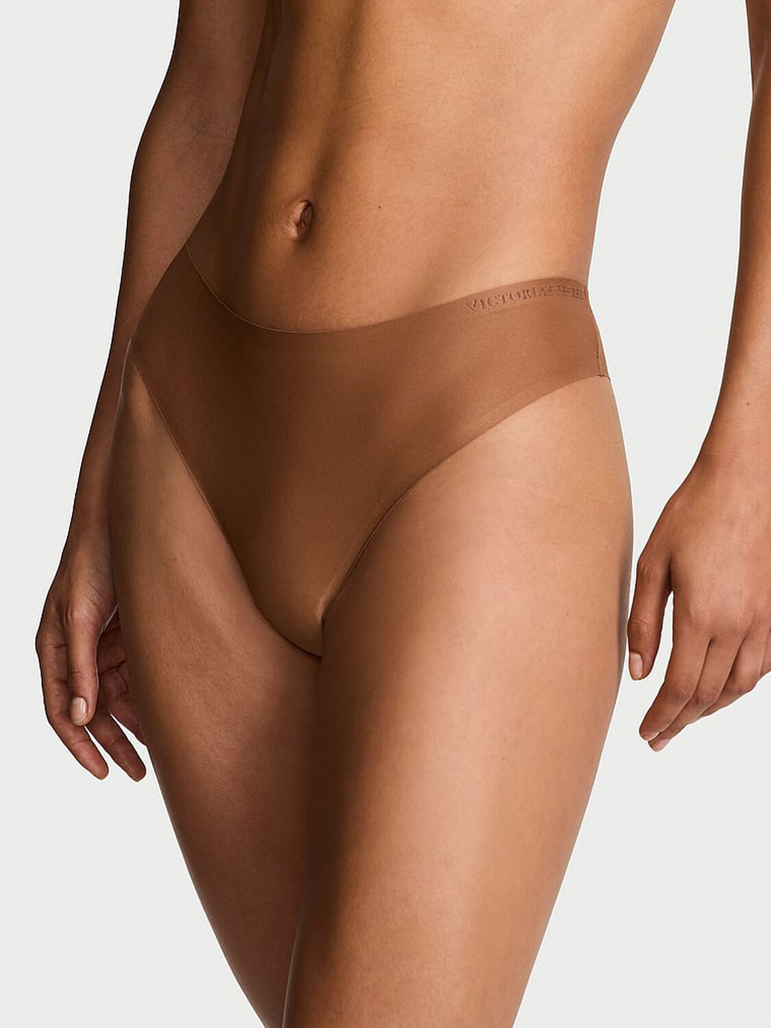 vs Body By Victoria Body by Victoria Flex Mid-Rise Thong Panty Caramel 1 of 3 