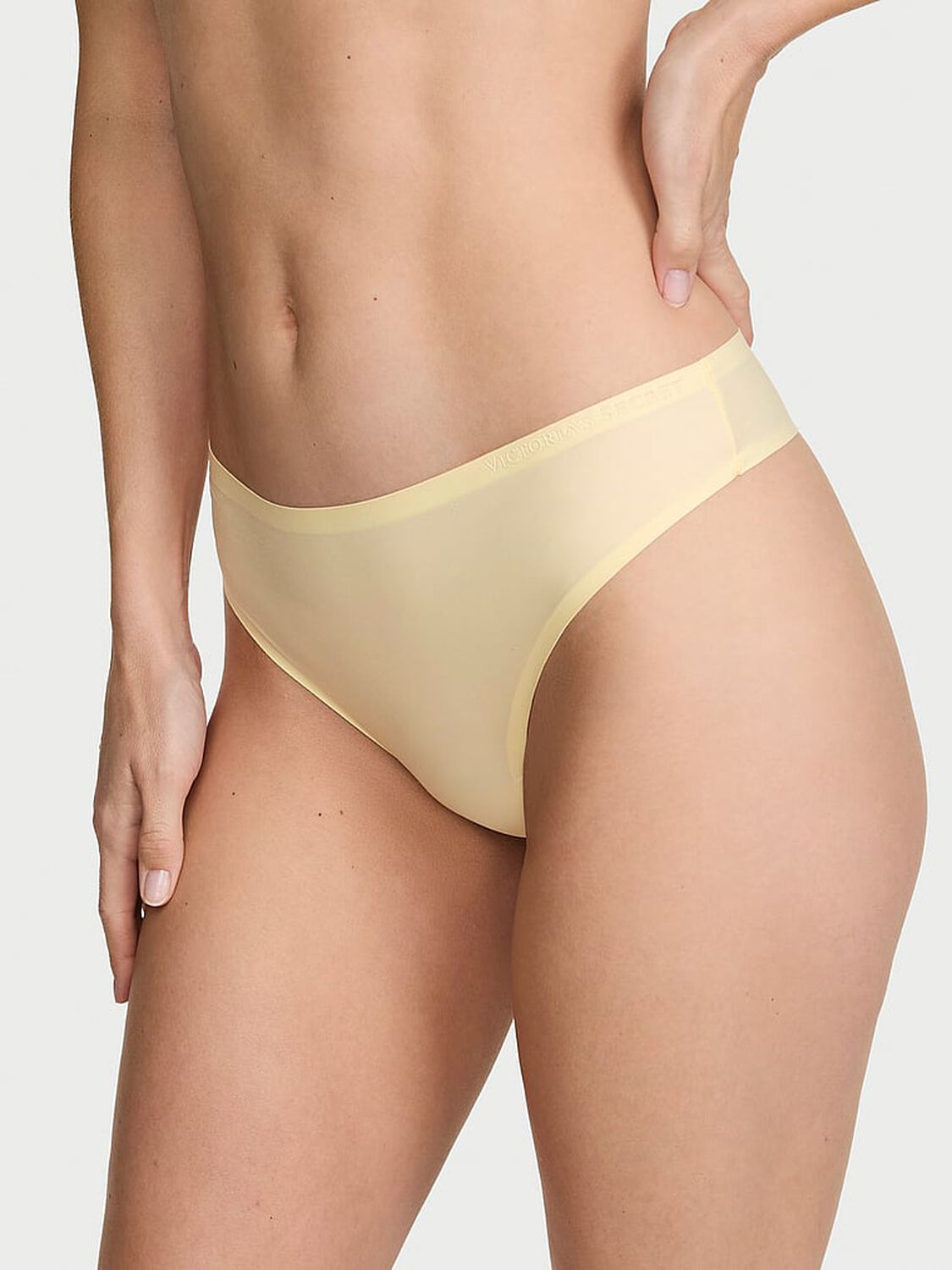 vs Body By Victoria Body by Victoria Flex Mid-Rise Thong Panty Sunny Honey 1 of 2 