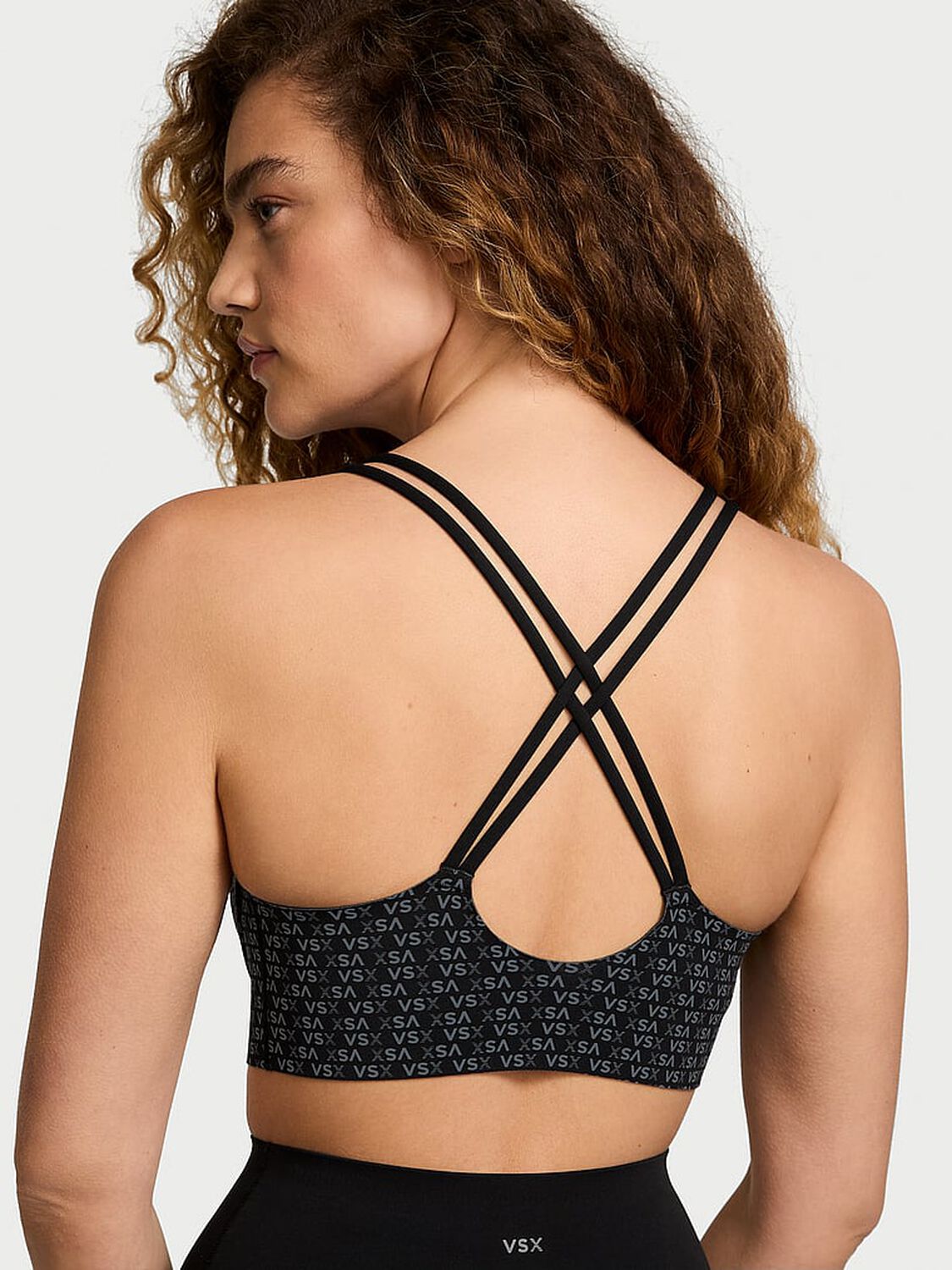 vs Vsx VSX Elevate™ Strappy-Comfort Sports Bra Black Vsx Logo 2 of 4 