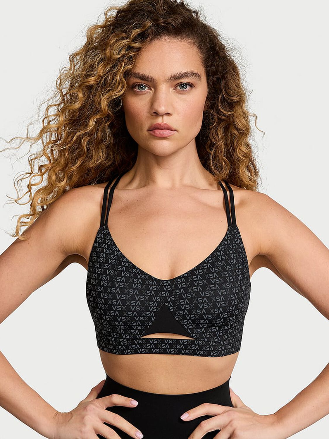 vs Vsx VSX Elevate™ Strappy-Comfort Sports Bra Black Vsx Logo 1 of 4 